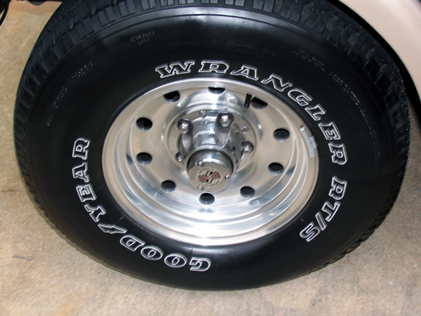 Close-up of a Goodyear Wrangler RT/S tire on a chrome wheel