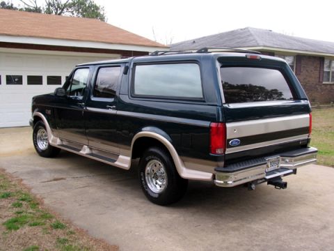 1995 Ford C-150 (Centurion Conversions) - This Ford Bronco Centurion conversion SUV has a two-tone paint scheme and a rear hitch receiver.