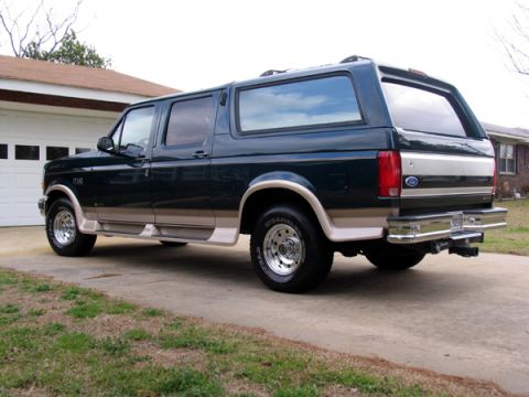 1995 Ford C-150 (Centurion Conversions) - This 1995 Ford C-150 Centurion Conversions SUV is seen from the rear three-quarter angle.