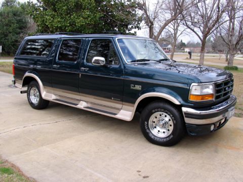 1995 Ford C-150 (Centurion Conversions) - This 1995 Ford C-150 Centurion Conversions SUV is shown from the front three-quarter angle.