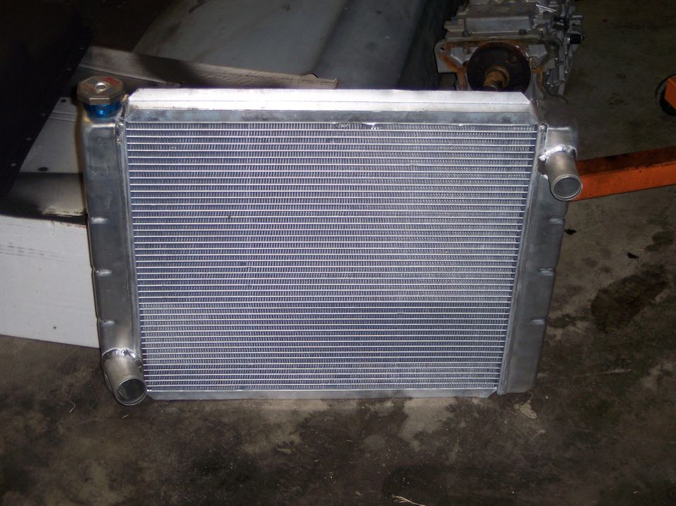 Aluminum radiator with blue cap and silver tanks
