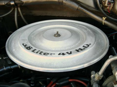 1984 Ford Bronco - Close-up of an engine air cleaner lid with text indicating its specifications.