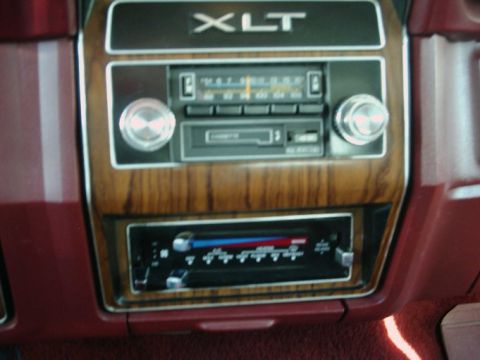1984 Ford Bronco - Interior view of a 1984 Ford Bronco XLT, highlighting the dashboard with radio and climate controls.