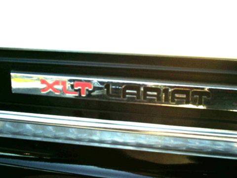 1984 Ford Bronco - Close-up of the XLT Lariat trim badge on a 1984 Ford Bronco.
