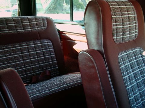 1984 Ford Bronco - Interior view of a 1984 Ford Bronco, highlighting the plaid seat pattern.