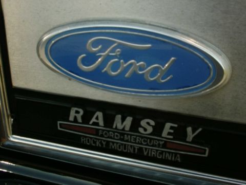1984 Ford Bronco - A Ford emblem is visible above a dealership nameplate from Rocky Mount, Virginia.