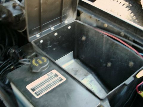 1984 Ford Bronco - Close-up of an engine bay component box, possibly for battery or tools.