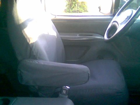 1992 Ford Bronco - The interior of a vehicle is shown, focusing on the driver's seat and dashboard area.