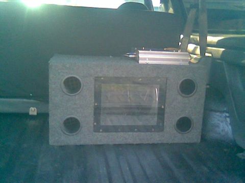 1992 Ford Bronco - An aftermarket subwoofer box with an amplifier is visible inside the vehicle's interior.
