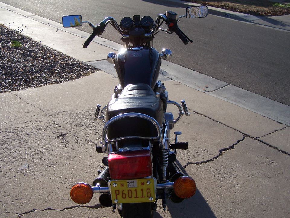Back view of a motorcycle with a yellow license plate