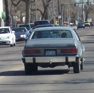 1972 Ford Ranchero - Rear view of a 1972 Ford Ranchero driving in traffic with other vehicles.