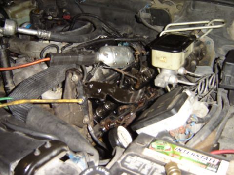 1992 Ford Bronco - Close-up view of an engine bay, showing various mechanical components and wiring.