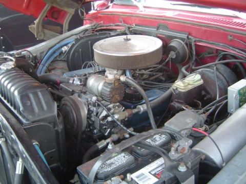 1979 Ford Bronco - Close-up view of a vehicle's engine bay, showing various components and wiring.