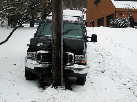 1992 Ford Taurus - Van collided with a utility pole during a snowfall.