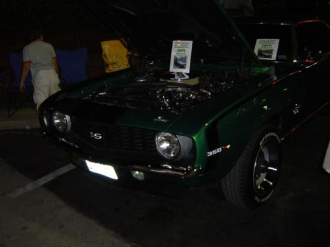 1979 Ford Bronco - A green 1969 Chevrolet Camaro SS is displayed with its hood up, revealing the engine bay.
