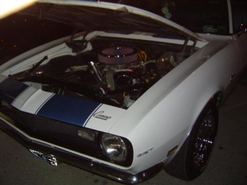 1979 Ford Bronco - This classic Chevrolet Camaro features a prominent engine bay and distinctive racing stripes.