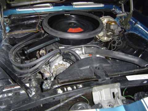 1979 Ford Bronco - Close-up view of the engine bay, showing various components like the air cleaner and alternator.