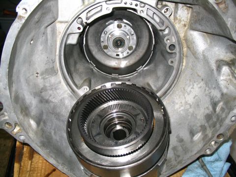 1984 Ford Bronco - Close-up of internal automatic transmission parts, including torque converter and gear set.