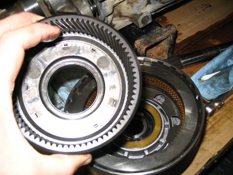 1984 Ford Bronco - A close-up view of a transmission gear and drum components, suggesting internal mechanical work.