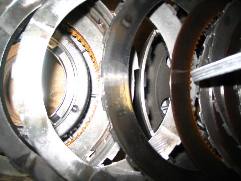 1984 Ford Bronco - Close-up view of a transmission clutch pack, showing wear and rust on the friction plates.