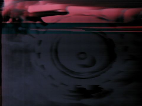 1984 Ford Bronco - A blurry, dark image shows a component of a vehicle's transmission, possibly a torque converter or planetary gear set.