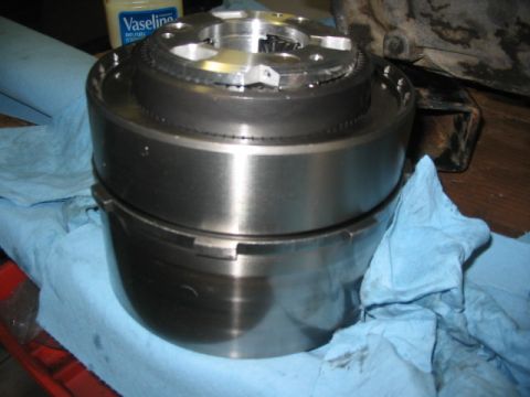 1984 Ford Bronco - A close-up view of a metal transmission component, with a jar of Vaseline visible.