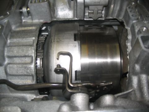 1984 Ford Bronco - This image shows the internal components of an automatic transmission, specifically the torque converter and associated linkage.