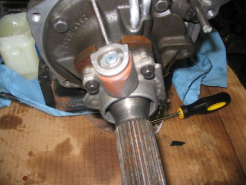 1984 Ford Bronco - This image shows a close-up view of a vehicle's transmission yoke and driveshaft, likely during a repair or maintenance procedure.