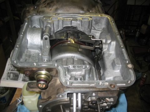 1984 Ford Bronco - Close-up view of the internal workings of an automatic transmission, with the pan removed.
