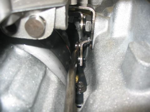 1984 Ford Bronco - A detailed view of a vehicle's transmission linkage mechanism.