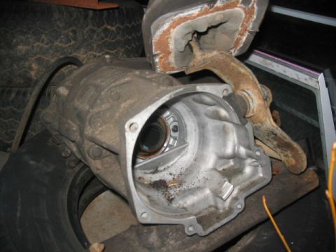 1984 Ford Bronco - Close-up of a transmission housing and associated parts, likely removed from a vehicle.