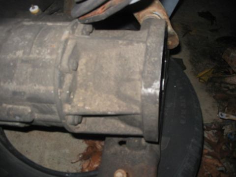 1984 Ford Bronco - This is a close-up view of a vehicle's transmission housing, showing its mechanical components.
