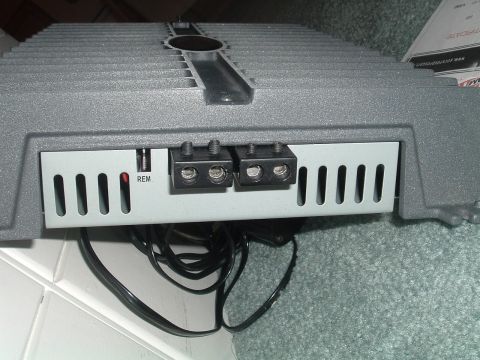1994 Ford Probe - A car amplifier with visible wiring and connection terminals is shown from the rear.