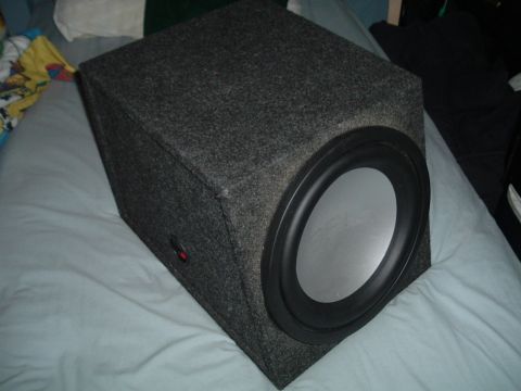 1994 Ford Probe - Car subwoofer in a box, likely for aftermarket audio installation.