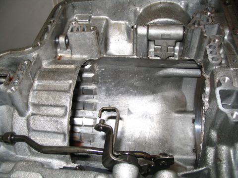 1984 Ford Bronco - Close-up view of the internal components of a transmission case, showing the shift lever mechanism.