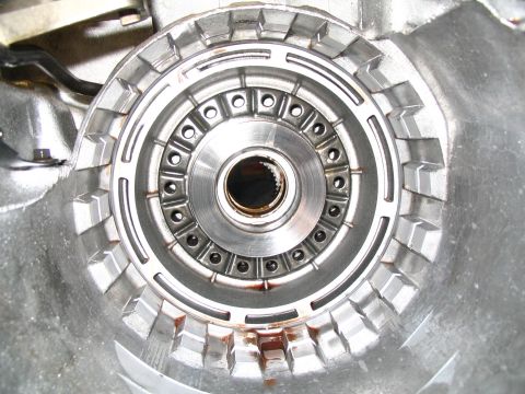 1984 Ford Bronco - Close-up view of a transmission torque converter housing, showing its internal components and splined shaft opening.