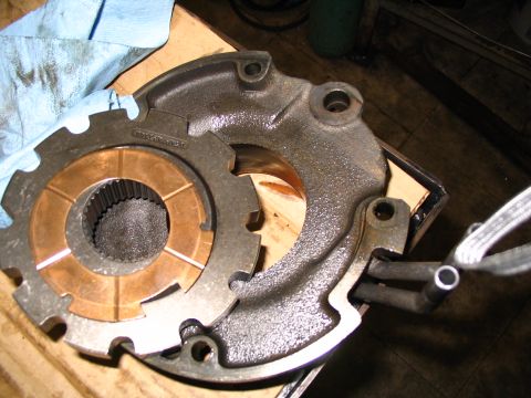 1984 Ford Bronco - Close-up of a transmission oil pump, showing the splined shaft and copper vanes. Text is visible on the pump housing.