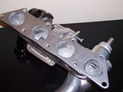 1999 Mitsubishi Mirage - Close-up of an aftermarket turbo manifold, not a complete vehicle.