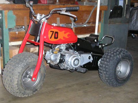 1900 Honda Big Red - ATV with a red gas tank displaying the number 70 and flame graphics.