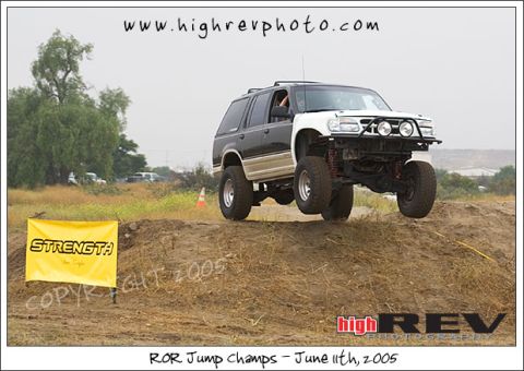 1985 Ford Bronco II - An off-road SUV soars through the air during an event on June 11th.