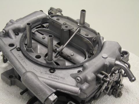1991 Ford LTD Crown Victoria - base of a Carter Thermo-Quad carburetor on a white towel, with the maker name cast into the body.
