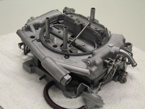 1991 Ford LTD Crown Victoria - Carter Thermo-Quad carburetor photographed from its base on a white towel, the brand cast into the casting.