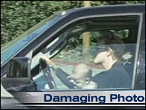 1991 Ford Bronco - Woman drives a vehicle with a baby in the passenger seat.