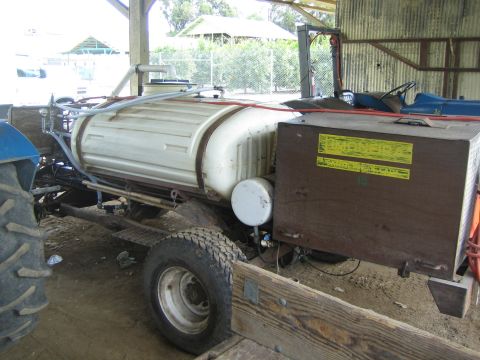 1968 Ford Mustang - This agricultural sprayer is mounted on a tractor, a large tank and various hoses and nozzles.