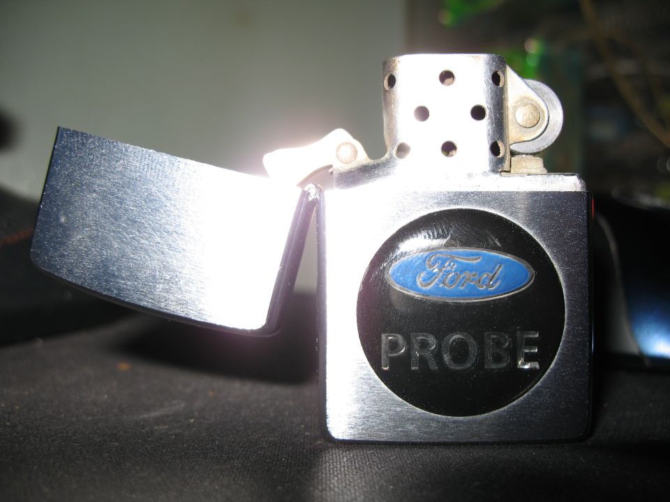 Chrome lighter with Ford Probe logo