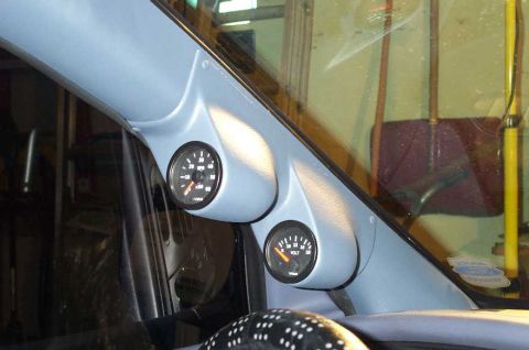 1998 Ford Crown Victoria - A-pillar gauge pod with tachometer and voltmeter, likely an aftermarket addition.