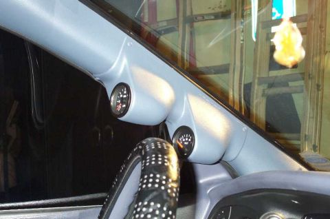 1998 Ford Crown Victoria - Custom A-pillar gauge pod installed in a vehicle's interior.