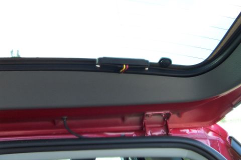 2005 Ford Explorer - Interior view of the rear hatch area of a 2005 Ford Explorer, showing wiring and a camera mount.