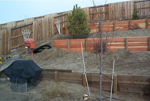 1986 Ford Bronco - We hired Countryside landscaping 885-TURF to add two retaining walls, drains, stairs, and ground cover. Here it is so far.