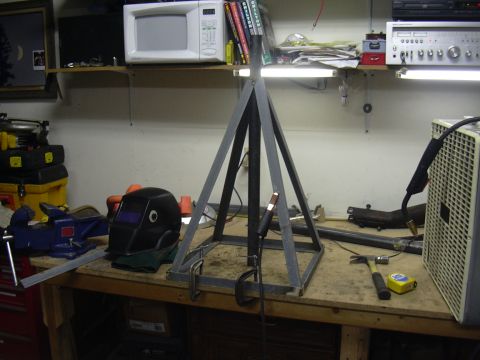 1991 Ford Bronco - A workbench is set up for a welding project, with various tools and safety equipment visible.